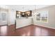 Open kitchen features stainless steel appliances, subway tile backsplash, and hardwood floors at 72 E Moss Creek Dr, Clayton, NC 27520