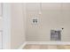 The empty laundry room has tile flooring, a dryer hookup, and is ready for appliances at 72 E Moss Creek Dr, Clayton, NC 27520