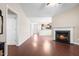 Open-concept living area with a fireplace flowing into kitchen and dining at 72 E Moss Creek Dr, Clayton, NC 27520