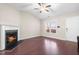 Empty living room featuring fireplace, high ceilings and hardwood floors at 72 E Moss Creek Dr, Clayton, NC 27520