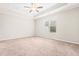 Spacious bedroom boasts plush carpet, neutral walls, and natural light at 72 E Moss Creek Dr, Clayton, NC 27520