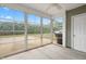 The enclosed sunroom offers a cozy retreat with large windows overlooking the backyard at 72 E Moss Creek Dr, Clayton, NC 27520