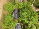 Aerial view of a home surrounded by mature trees showcasing its private setting at 7709 Oakmont Pl, Raleigh, NC 27615