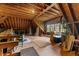 A spacious attic with exposed wood beams, a window, and a hardwood floor at 7709 Oakmont Pl, Raleigh, NC 27615