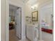 Bright bathroom featuring a vanity with an open view into other rooms at 7709 Oakmont Pl, Raleigh, NC 27615