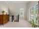 Spacious bedroom featuring a dresser with a window and plenty of natural light at 7709 Oakmont Pl, Raleigh, NC 27615