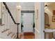Traditional foyer with hardwood floors, staircase, and elegant chandelier at 7709 Oakmont Pl, Raleigh, NC 27615