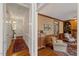 Hallway showing hardwood floors and trim leading to a living area and a front door at 7709 Oakmont Pl, Raleigh, NC 27615