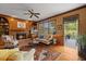 Living room boasts a fireplace, wooden built-ins, and a large glass patio door at 7709 Oakmont Pl, Raleigh, NC 27615