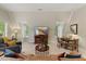 Cozy living room with vaulted ceilings, comfortable seating, and bright windows at 7709 Oakmont Pl, Raleigh, NC 27615