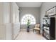 Bathroom featuring a window, chair, and built-in cabinet for storage at 7709 Oakmont Pl, Raleigh, NC 27615