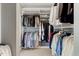Organized walk-in closet with custom shelving and hanging rods at 7709 Oakmont Pl, Raleigh, NC 27615