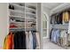Custom walk-in closet with shelving and hanging rods for organizing clothes and accessories at 7709 Oakmont Pl, Raleigh, NC 27615