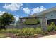 A beautiful stone sign marks the Holding Village community entrance on a sunny day at 801 Hyperion Aly, Wake Forest, NC 27587