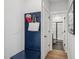 Entryway with a blue mud bench and coat rack, leading to a bathroom with a glass shower at 801 Hyperion Aly, Wake Forest, NC 27587