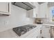 Modern kitchen with stainless steel appliances, white cabinetry, subway tile backsplash and gas cooktop at 801 Hyperion Aly, Wake Forest, NC 27587