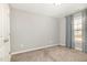 Inviting bedroom with a window adorned with curtains and plush carpet at 8021 Crookneck Dr, Angier, NC 27501