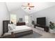 Main bedroom featuring vaulted ceiling, multiple windows, and plush carpet at 8021 Crookneck Dr, Angier, NC 27501