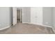 Bedroom featuring plush carpet, fresh paint, and closet for ample storage at 8021 Crookneck Dr, Angier, NC 27501