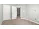 Bedroom featuring plush carpet, fresh paint, and a closet for ample storage at 8021 Crookneck Dr, Angier, NC 27501