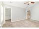 Bright bedroom offers a neutral color palette, plush carpeting, and convenient closet access at 8021 Crookneck Dr, Angier, NC 27501