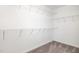 Walk-in closet with wire shelving, providing ample storage space at 8021 Crookneck Dr, Angier, NC 27501