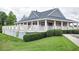 Charming community clubhouse with welcoming porch and manicured landscaping in a beautiful residential area at 8021 Crookneck Dr, Angier, NC 27501