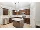 Kitchen with stainless steel appliances, granite countertops, kitchen island, and ample cabinet space at 8021 Crookneck Dr, Angier, NC 27501