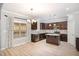 Kitchen with stainless appliances, granite counters, and island with pendant lighting at 8021 Crookneck Dr, Angier, NC 27501