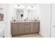 Modern bathroom features a double vanity with sleek countertops and ample storage at 813 Fireship Rd, Fuquay Varina, NC 27526