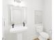 Stylish bathroom featuring a pedestal sink, modern fixtures, and a clean, minimalist design at 813 Fireship Rd, Fuquay Varina, NC 27526