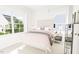 Bright bedroom with large windows, a comfortable bed, and stylish decor creating a relaxing atmosphere at 813 Fireship Rd, Fuquay Varina, NC 27526
