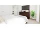 Relaxing bedroom with a cozy bed, modern decor, and plenty of natural light at 813 Fireship Rd, Fuquay Varina, NC 27526