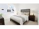 Well-lit bedroom boasts a stylish bed frame, plush bedding, and a welcoming ambiance at 813 Fireship Rd, Fuquay Varina, NC 27526