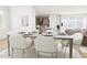 Elegant dining room with ample natural light and a stylish table setting for Gathering gatherings at 813 Fireship Rd, Fuquay Varina, NC 27526