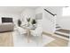 Cozy dining room next to stairs and living room with modern furnishings and decor at 813 Fireship Rd, Fuquay Varina, NC 27526