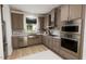 Modern kitchen with stainless steel appliances, ample counter space and stylish finishes at 813 Fireship Rd, Fuquay Varina, NC 27526