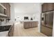 Open kitchen layout featuring a large island and seamlessly connected living spaces at 813 Fireship Rd, Fuquay Varina, NC 27526