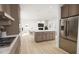 Spacious open concept kitchen with modern appliances and a large island perfect for entertaining at 813 Fireship Rd, Fuquay Varina, NC 27526