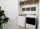 Convenient laundry room featuring modern appliances, storage, and stylish decor at 813 Fireship Rd, Fuquay Varina, NC 27526