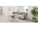 Comfortable living room with a sectional sofa, stylish decor, and plenty of natural light at 813 Fireship Rd, Fuquay Varina, NC 27526