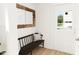 Charming mudroom with a bench, decorative mirror, and an inviting entryway at 813 Fireship Rd, Fuquay Varina, NC 27526