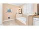Relaxing bathroom with a built-in bathtub, shuttered window, and stylish vanity with granite countertop at 88 Eltham, Rocky Mount, NC 27804