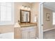 Charming bathroom vanity features granite countertops, framed mirror, and elegant lighting at 88 Eltham, Rocky Mount, NC 27804