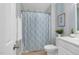 Bathroom with striped wallpaper and diamond pattern shower curtain at 88 Eltham, Rocky Mount, NC 27804