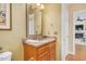 Bathroom features a vanity with granite countertops and view into the living room at 88 Eltham, Rocky Mount, NC 27804