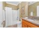 Well-lit bathroom features a shower-tub combo and a vanity with granite countertops at 88 Eltham, Rocky Mount, NC 27804