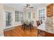 Cozy dining area featuring a glass table, four chairs, and three bright windows at 88 Eltham, Rocky Mount, NC 27804