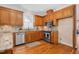 Well-equipped kitchen offers a tile backsplash, hardwood floors, and stainless appliances at 88 Eltham, Rocky Mount, NC 27804