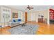 Bright living room with hardwood floors, a ceiling fan, and a view of a doorway and a built-in cabinet at 88 Eltham, Rocky Mount, NC 27804